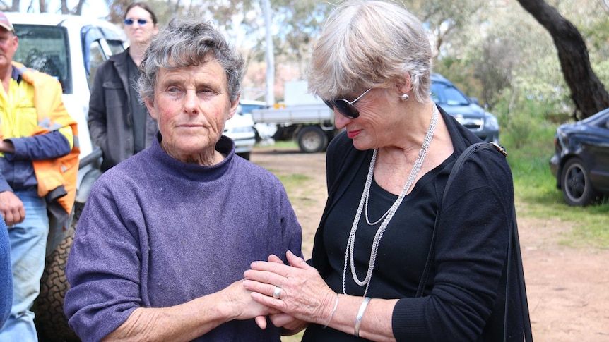 Vet Jan Spate with a supporter outside her practice.