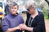 Vet Jan Spate with a supporter outside her practice.