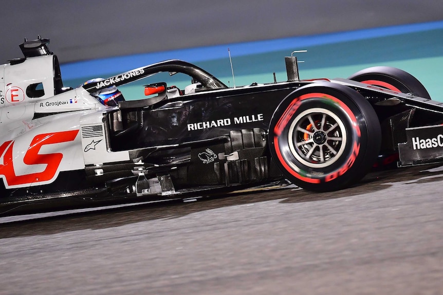 A close-up of Romain Grosjean's Formula One car, including the protective halo around his head.