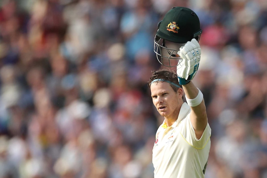 Australia's Steve Smith raises his helmet after scoring a century against England/