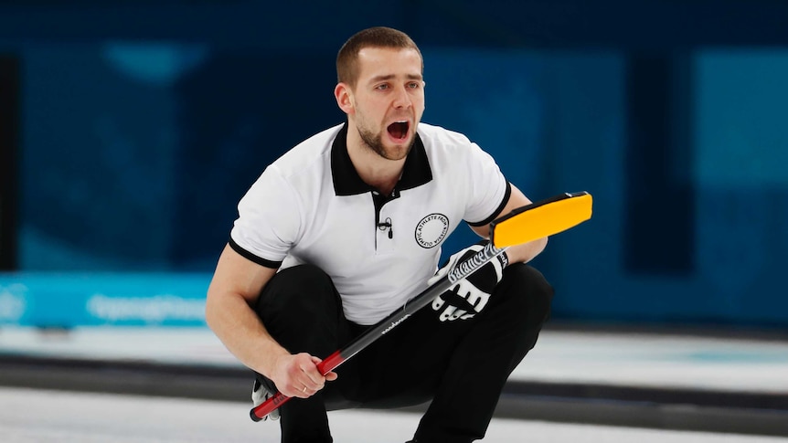 Alexander Krushelnitsky watches on during Olympic curling