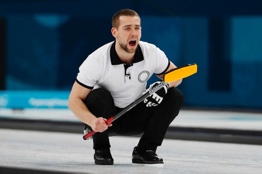 Alexander Krushelnitsky watches on during Olympic curling