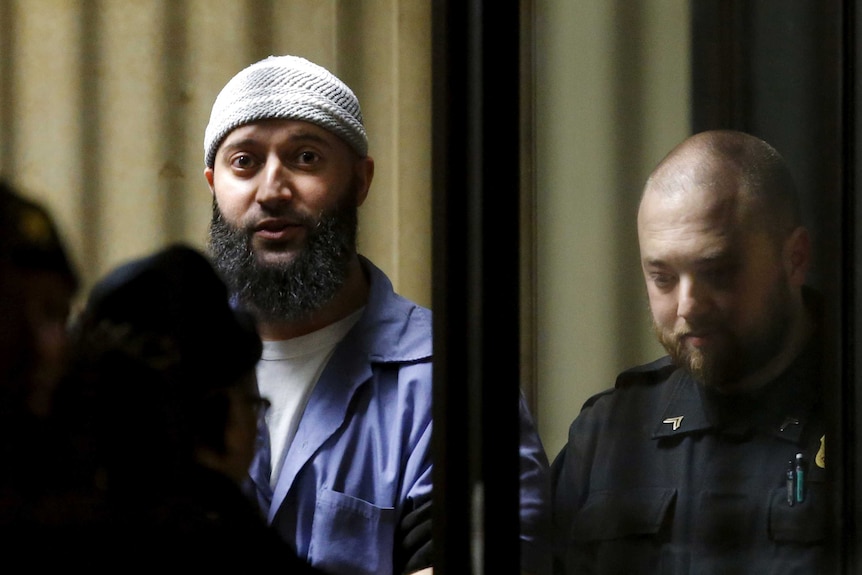 Convicted murderer Adnan Syed leaving the Baltimore courthouse.