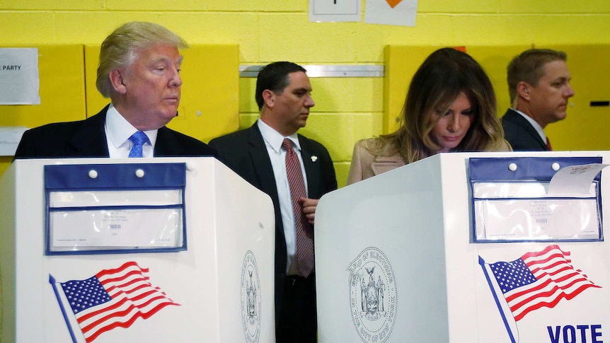 Donald and Melania Trump at a 2016 US election voting booth