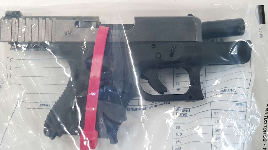 A pistol seized by SA Police in an evidence bag.