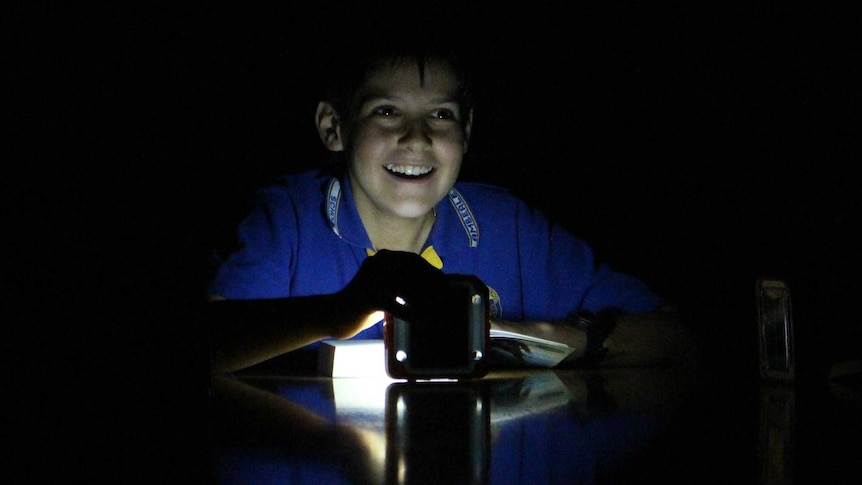 A Year 6 student from Amberley District State School student in solar light