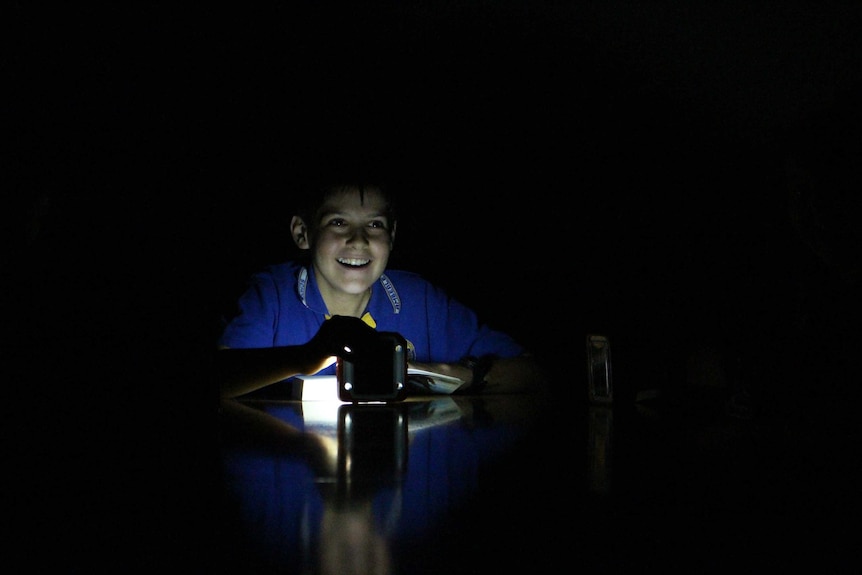 A Year 6 student from Amberley District State School student in solar light