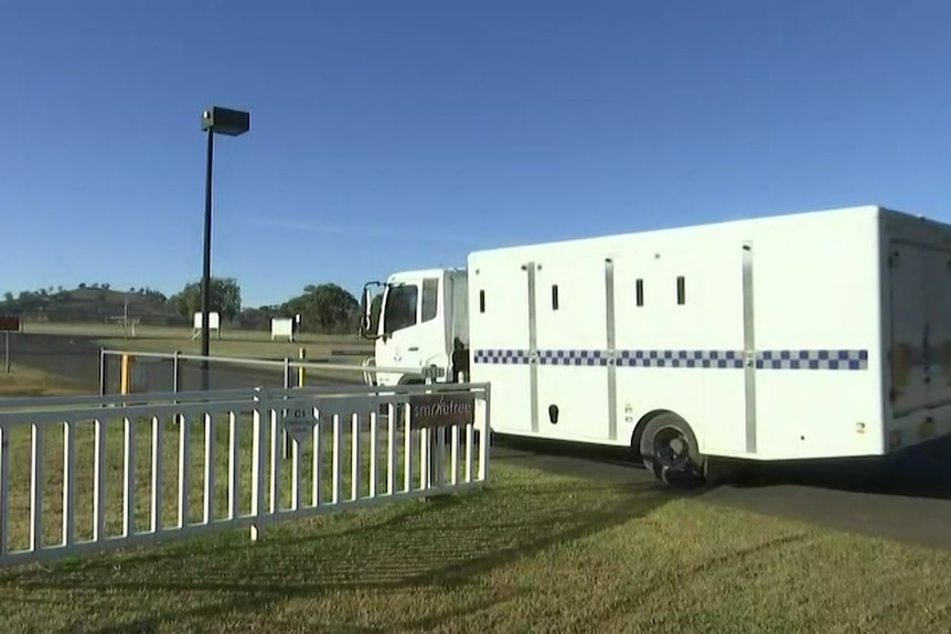 police truck driving out of Wellington Correctional Centre