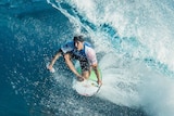 Gabriel Medina is seen surfing in a barrel.