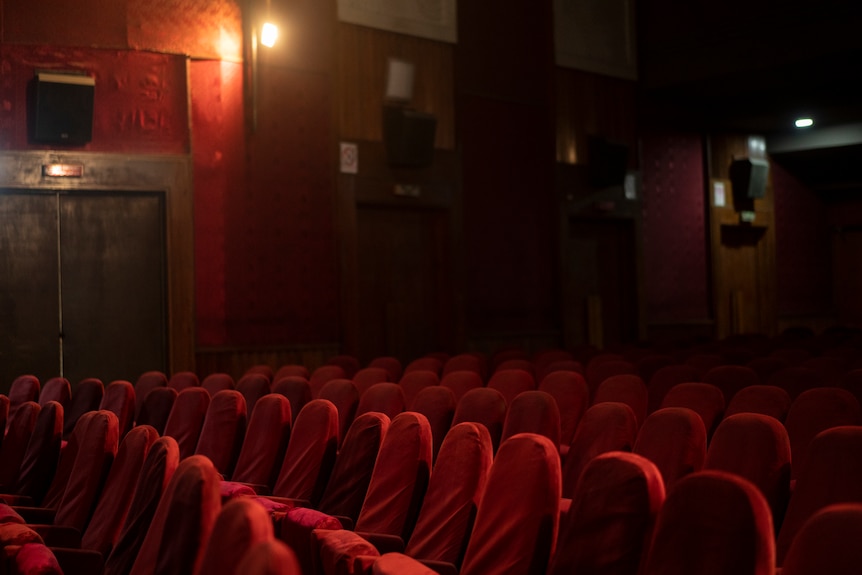 Empty cinema with red seats