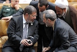 Mohammed Morsi speaks to Iranian officials during Non-Aligned Movement summit in Tehran