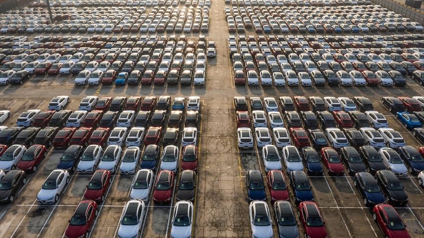 Aerial shot of new cars lined up at port
