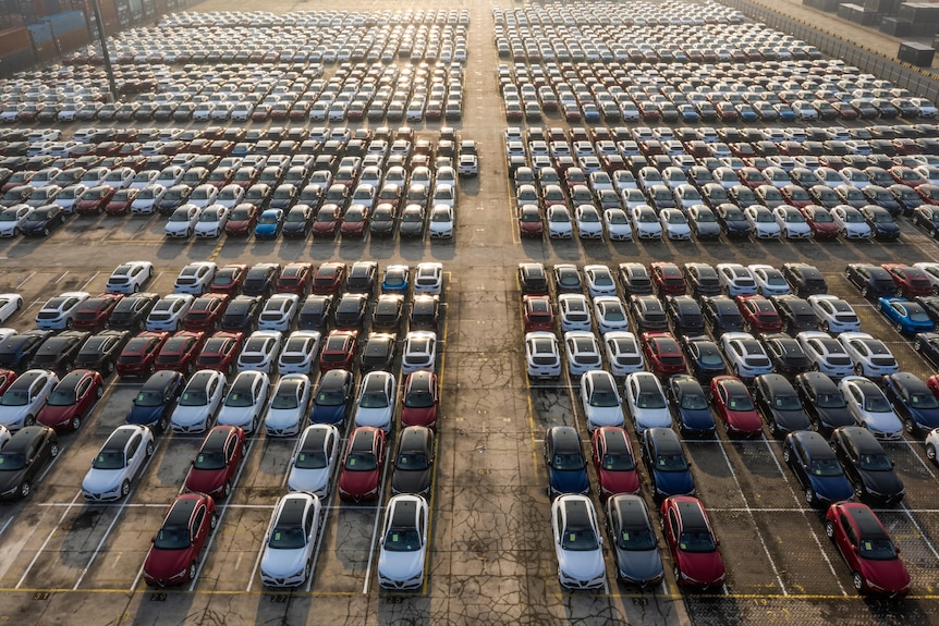 Aerial shot of new cars lined up at port