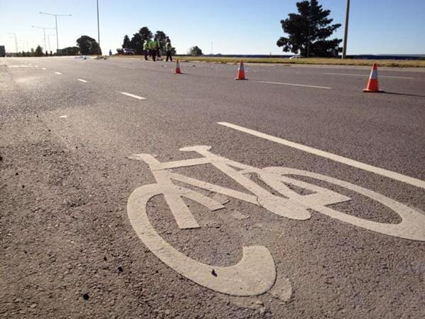 Police at the scene at Epping in Melbourne after a cyclist was killed in a collision with a truck.