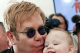Elton John kisses Lev