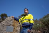 Kambalda mechanic Norm Karafilis stands at the monument marking the discovery of nickel near the town in 1966.