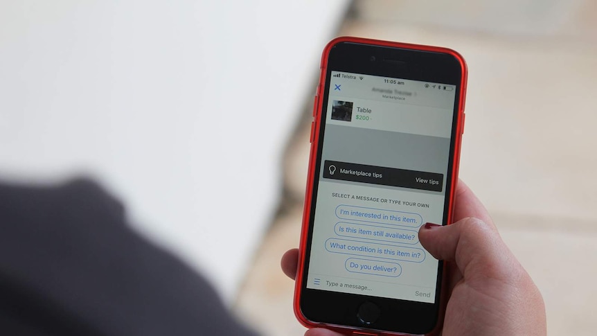 A photo of a phone being used to buy a table on Facebook.