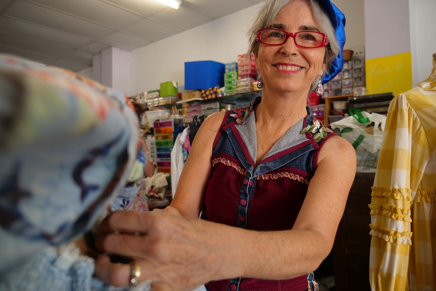 Wendy Mylrea stands in her shop smiling at the camera.