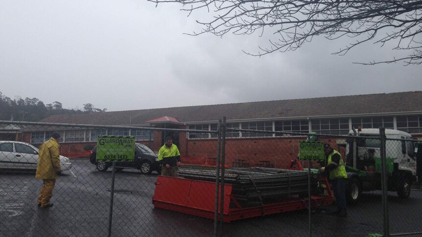 Kings Meadows High School in Launceston was evacuated after wild winds dislodged roof tiles from the building.
