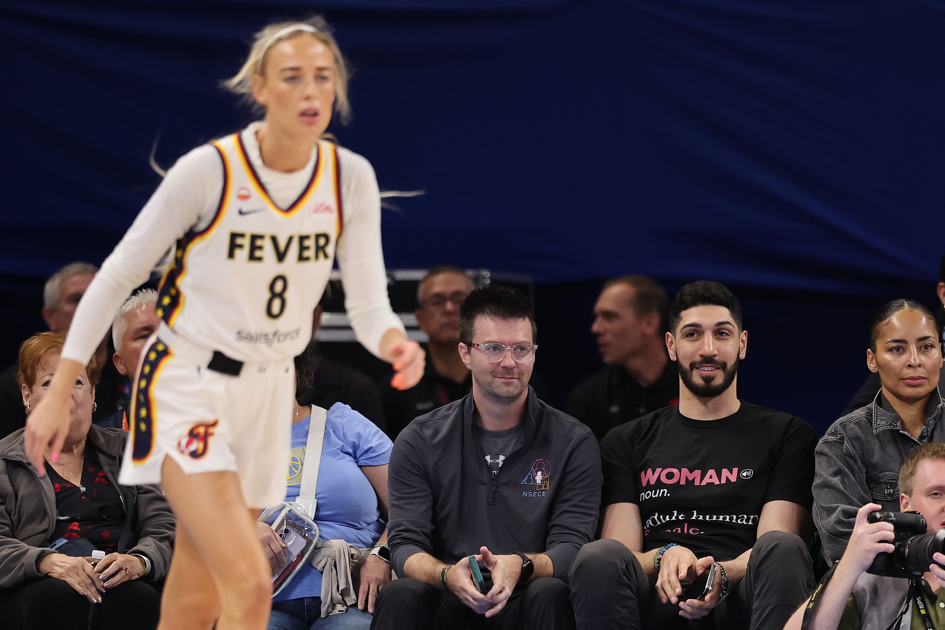 Enes Kanter watches Sophie Cunningham during a WNBA game.
