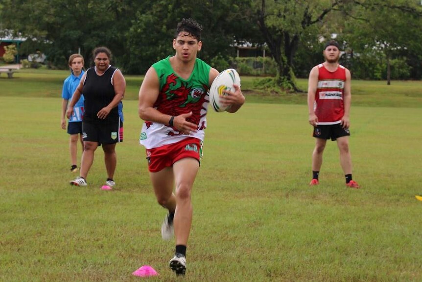 A bunch of rugby players at training.