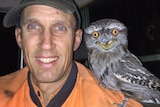 SA farmer Robin Schaefer takes a selfie with a local Tawny Frogmouth bird