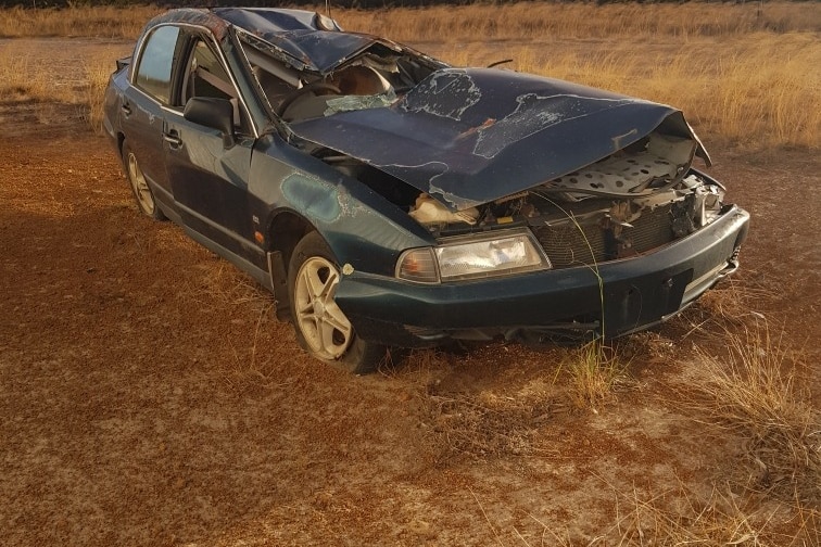 A black sedan crushed after a crash