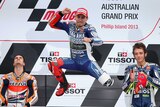 Spain's Jorge Lorenzo leaps on the podium after winning the Australian MotoGP.