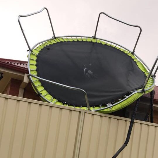 A trampoline is blown onto a house in Mildura after a severe storm.