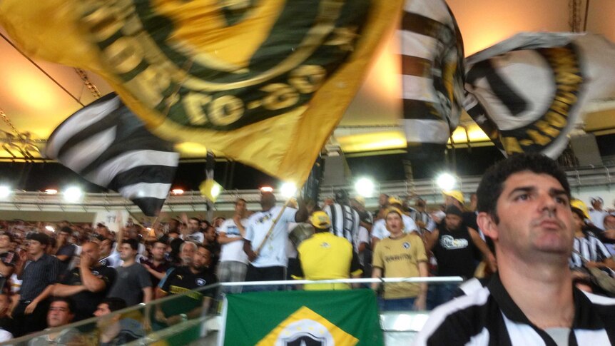 Botafogo fans wave flags at the Maracana