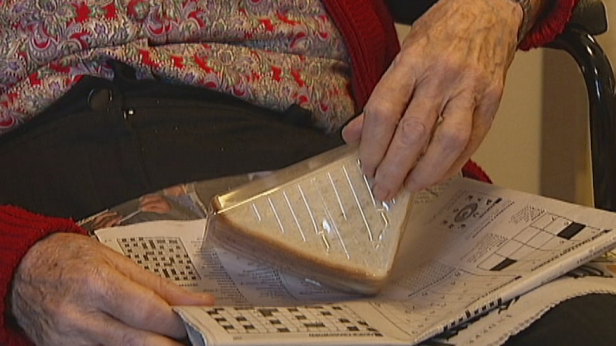 An elderly woman with arthritis struggled to open food packages but was refused help by staff.