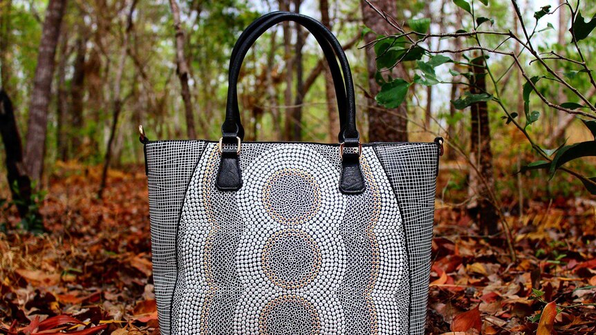 handbag in the bush painted with dreaming style indigenous artwork