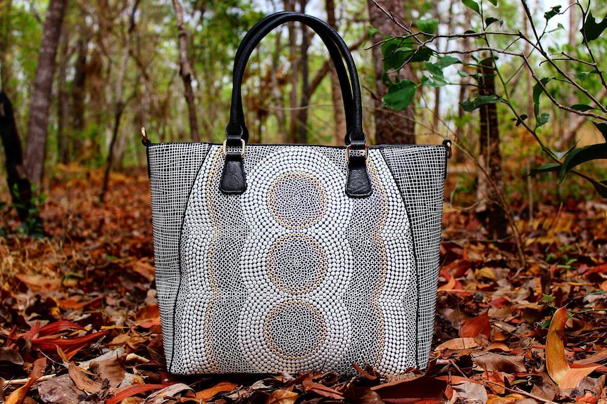handbag in the bush painted with dreaming style indigenous artwork