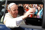 Pope Francis waves to the crowd