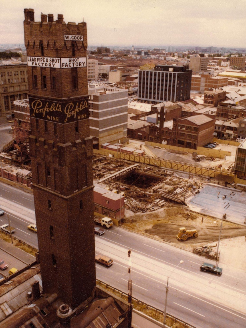 An aerial view of a shot tower looking over a construction site