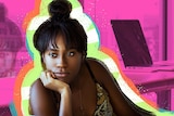 A woman turns away from her desk, looking bored.