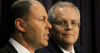 Scott Morrison looks at Josh Frydenberg speaking during