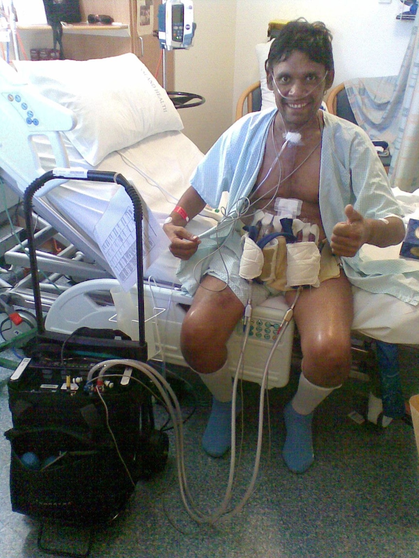 Peter Daley in hospital connected to his mechanical heart.