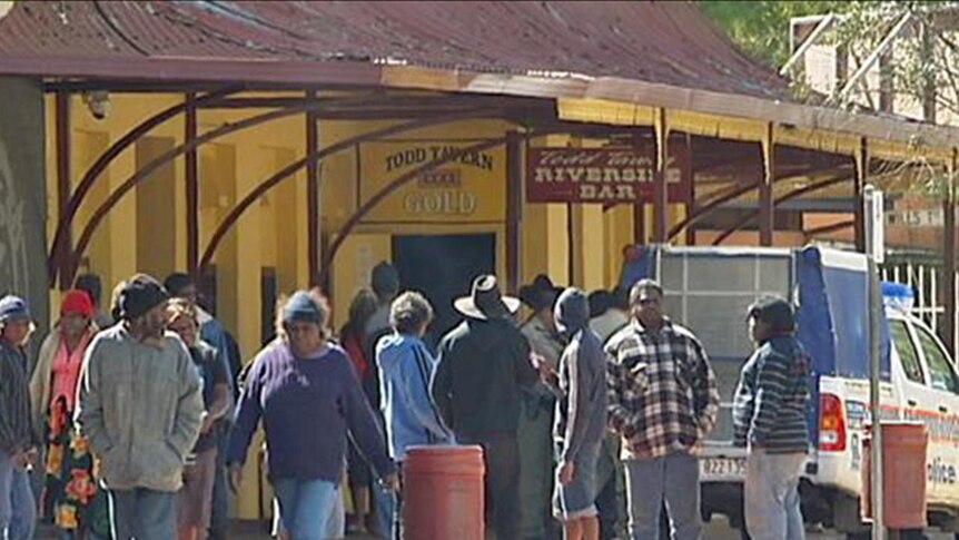People mill about outside the Todd Tavern in Alice Springs