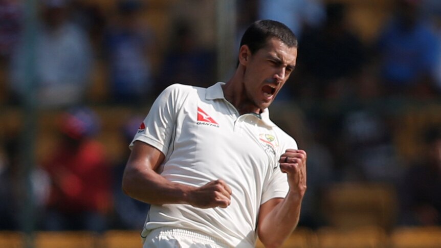 Mitchell Starc celebrates a wicket for Australia against India in Bangalore.