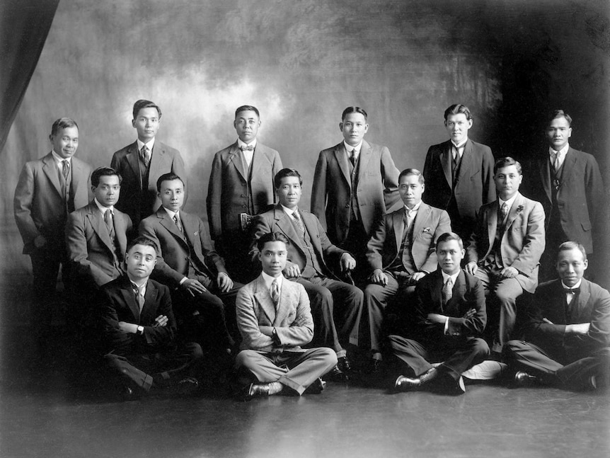 A studio group portrait of several Chinese-Australian men dressed in business attire.