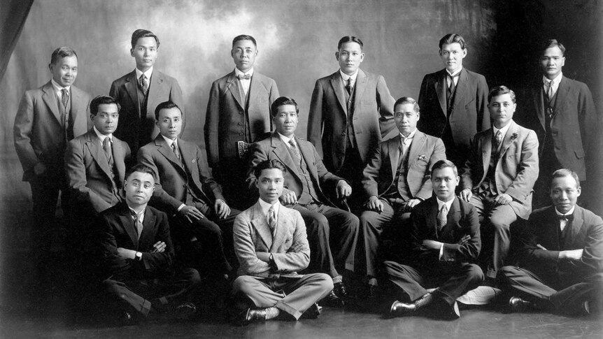 A studio group portrait of several Chinese-Australian men dressed in business attire.