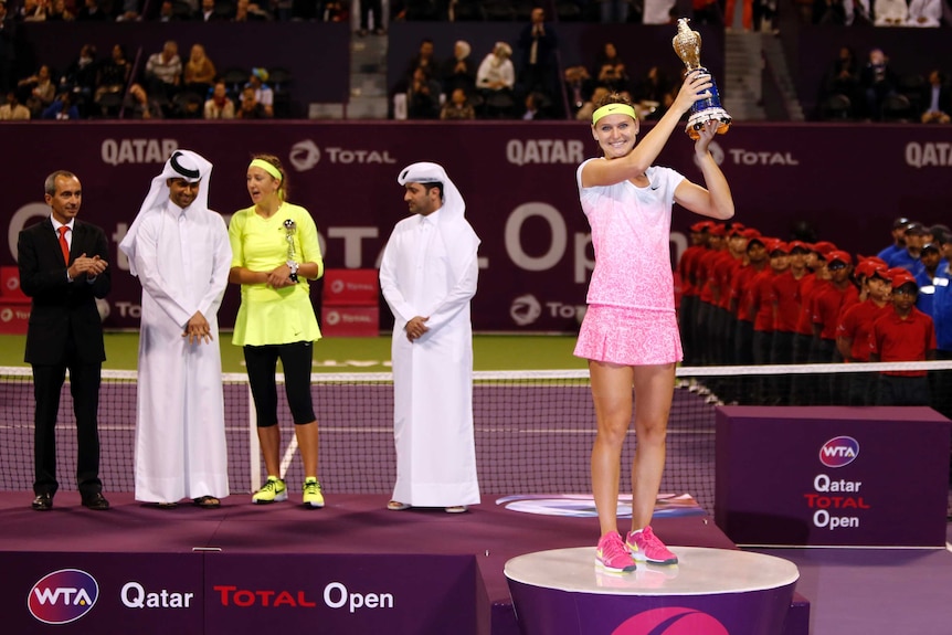Lucie Safarova celebrates with the Qatar Open trophy