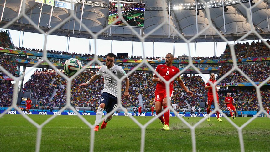 France's Mathieu Valbuena scores his team's third goal against Switzerland.