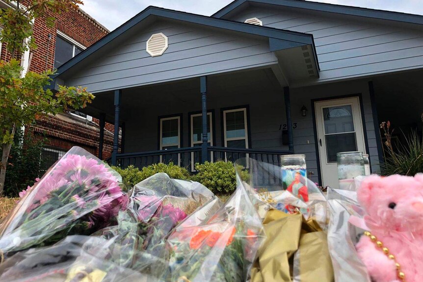 Floral tributes are laid outside Atatiana Jefferson's house.