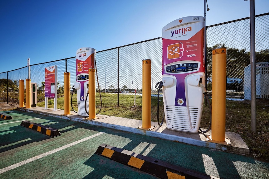 A row of electric bowsers for charging electric vehicles.