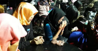 A group of women praying in nightclub