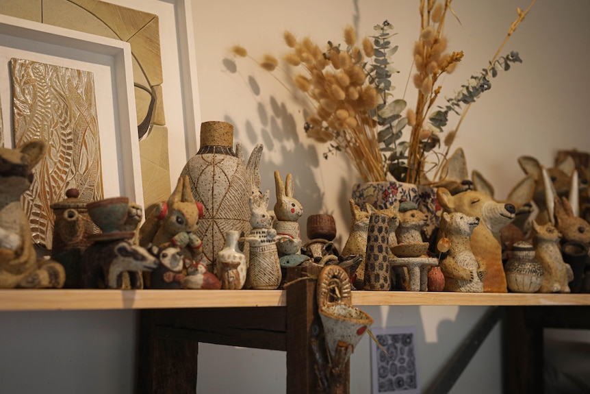 A collection of ceramic forest creatures like rabbits and bears.