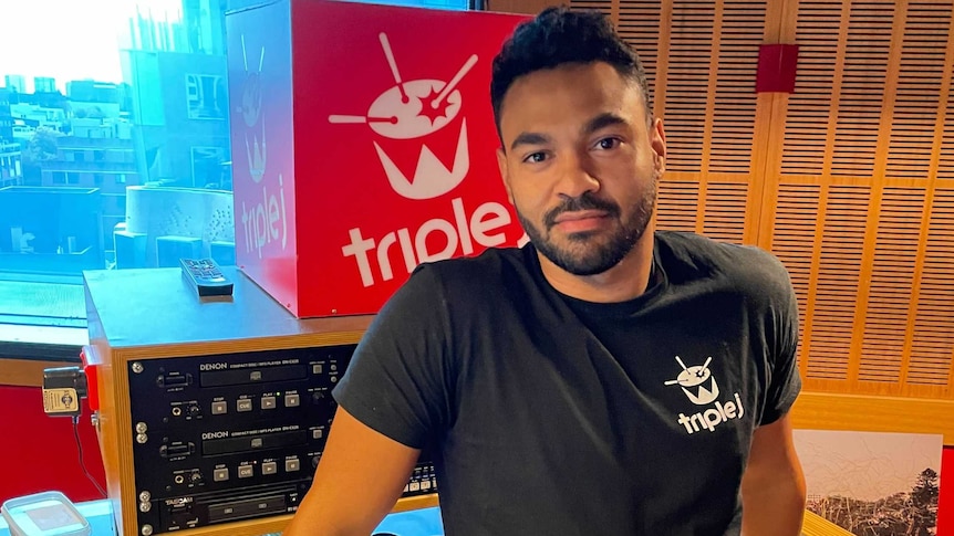 A man stands in a radio studio