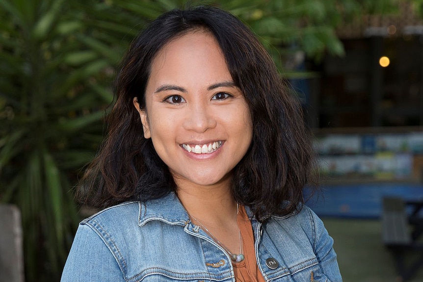 A woman wearing a denim jacket